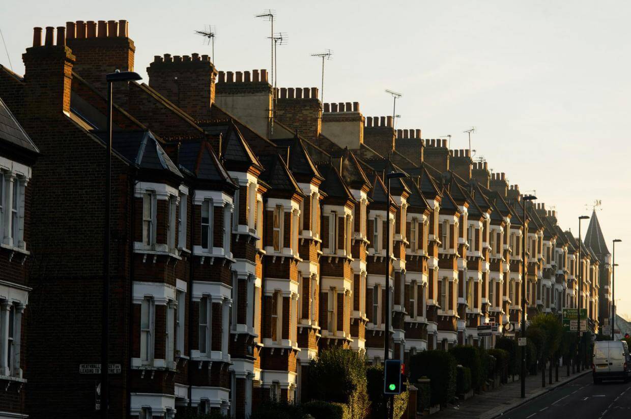 Sunrise over a row of houses